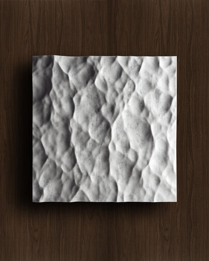Liquid marble wall sculpture displayed on a warm walnut background