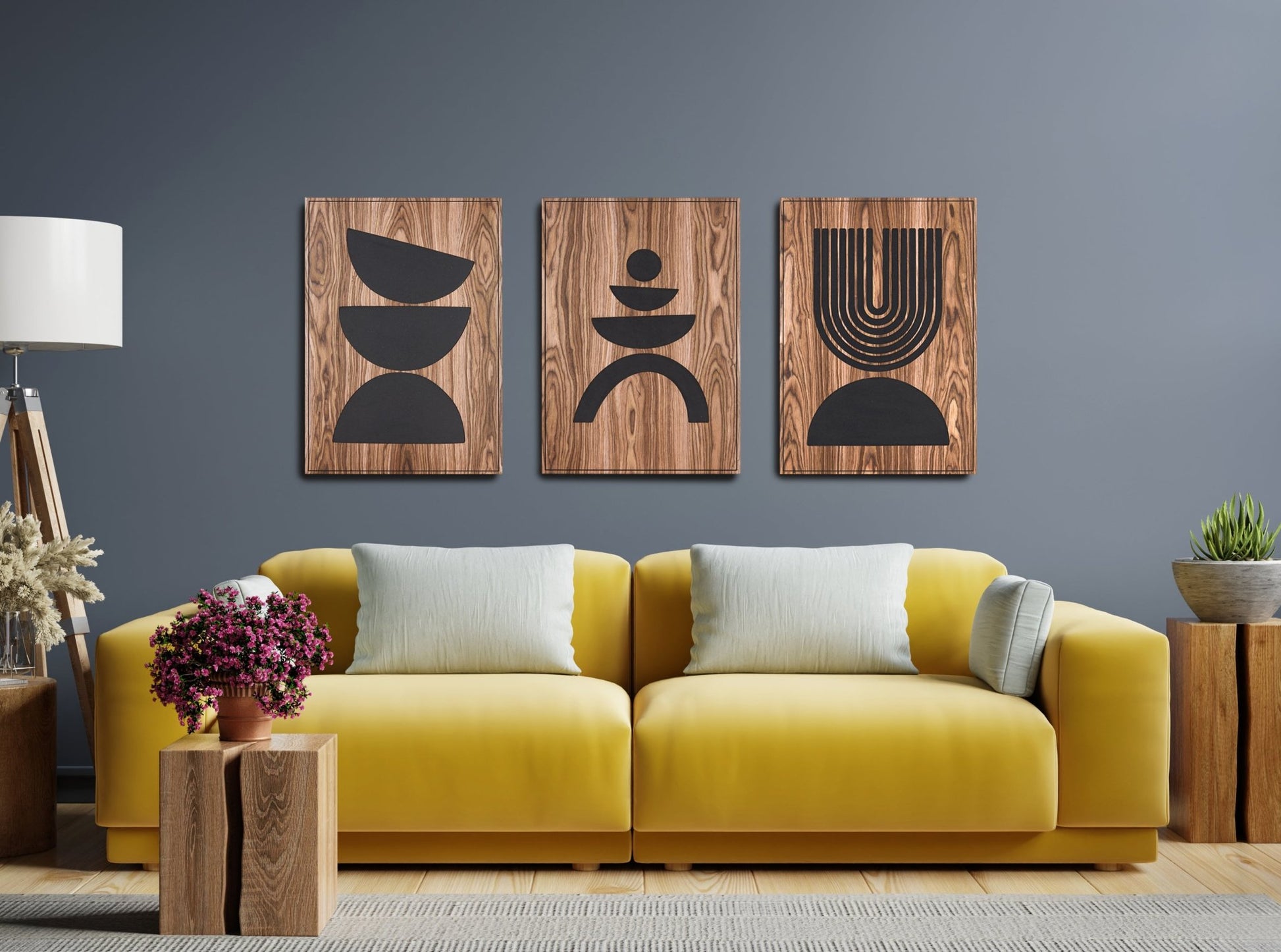 Three panel Arc Suite Walnut triptych with black inlay installed above a yellow sofa