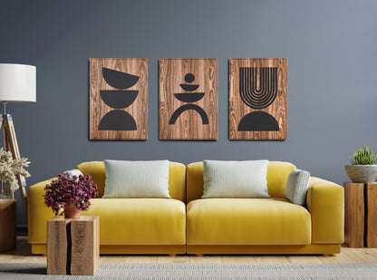 Three panel Arc Suite Walnut triptych with black inlay installed above a yellow sofa