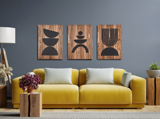 Three panel Arc Suite Walnut triptych with black inlay installed above a yellow sofa