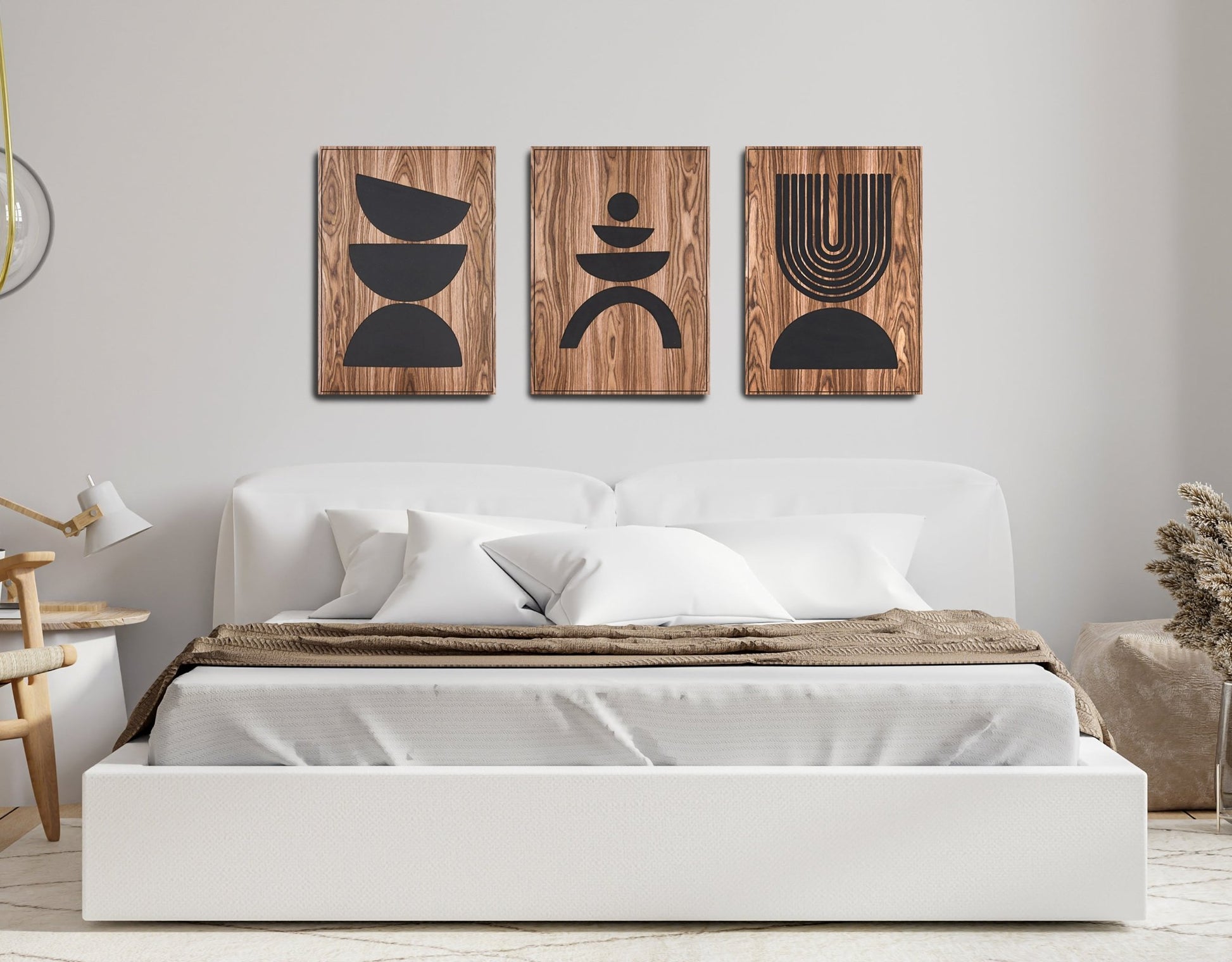 Arc Suite Walnut triptych of three walnut panels with black inlay mounted above a bed