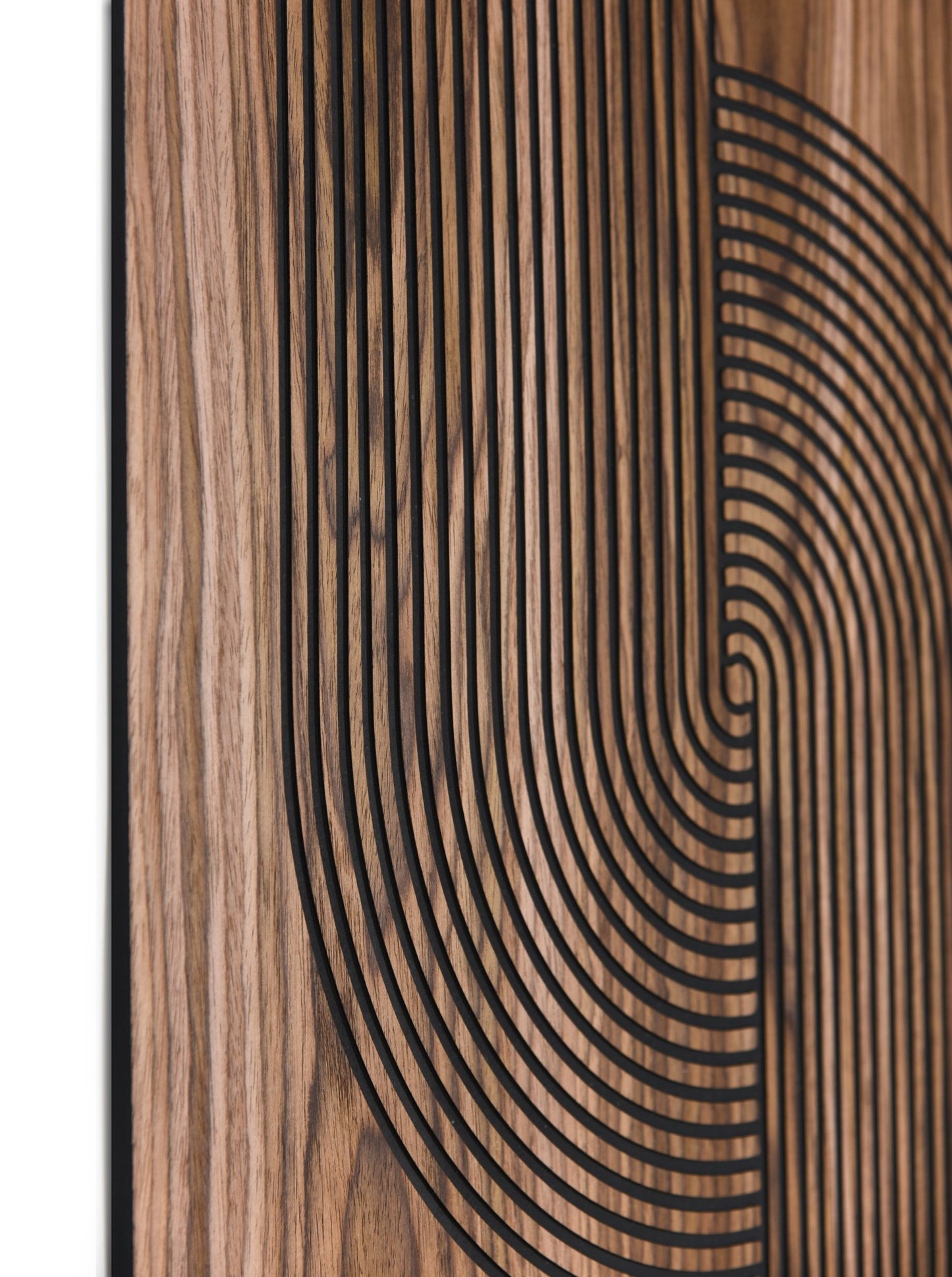Close up showing the linear texture and curved inlay pattern on walnut