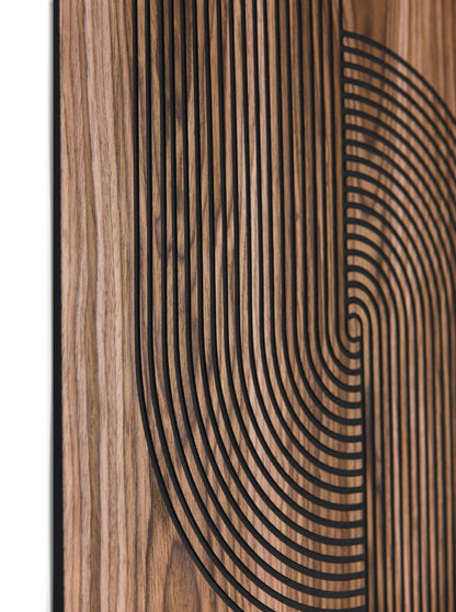 Close up showing the linear texture and curved inlay pattern on walnut