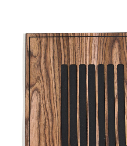 Close up of the curved line pattern with black inlay on walnut