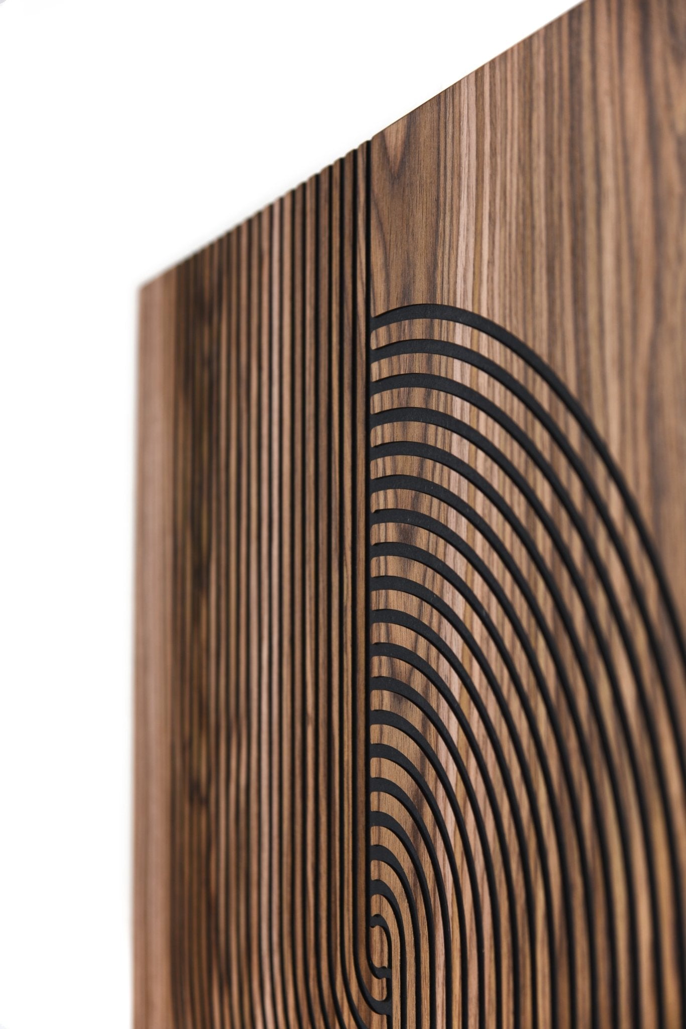 Side close up of walnut panel showing black inlay depth and clean edge finishing