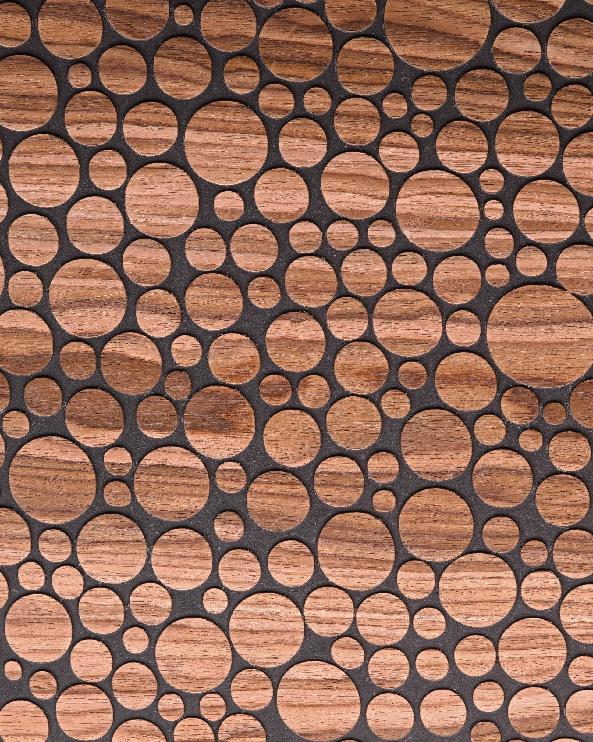 Corner close up of bubble pattern and walnut grain with engraved detail