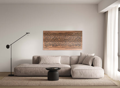 Bubble walnut and black wall panel above sofa, styled living room view