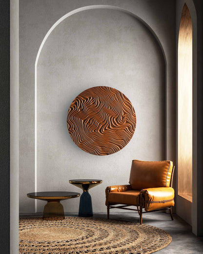 A circular Iroko wood sculpture with canyon ridges mounted on a wood accent wall, adding big wall decor impact in a calm living room.