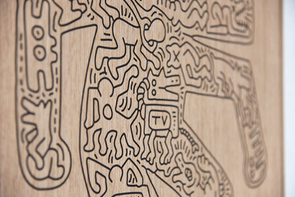 Detail close up of the carved lines and relief depth on the Crocodile Keith Haring oak artwork