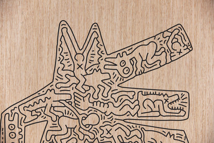Close up of the carved black line work on the Crocodile Keith Haring oak wall artwork