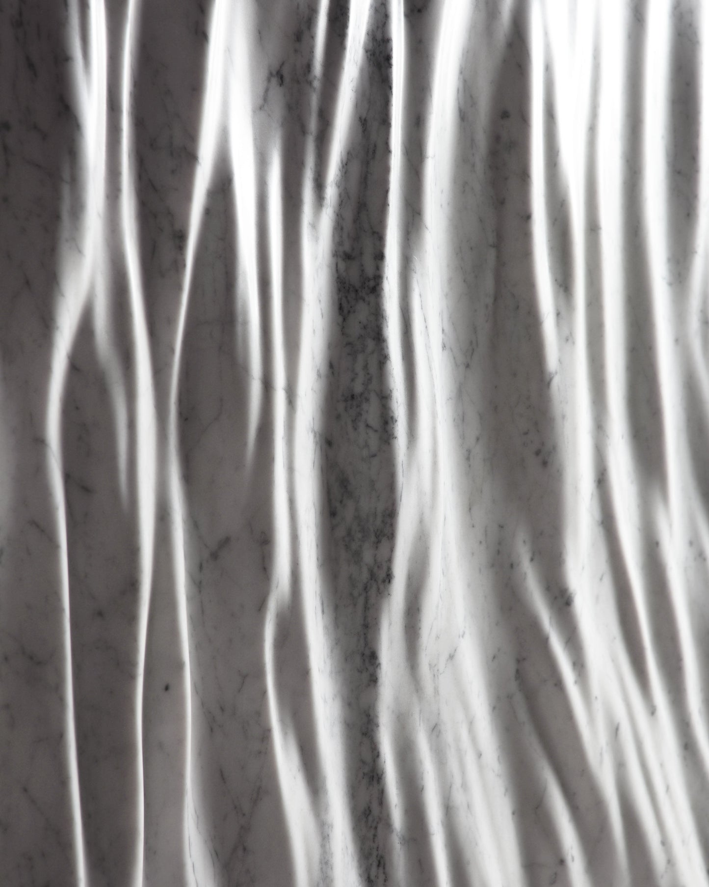 High contrast close up of the Eternal Carrara marble folds with deep shadow lines