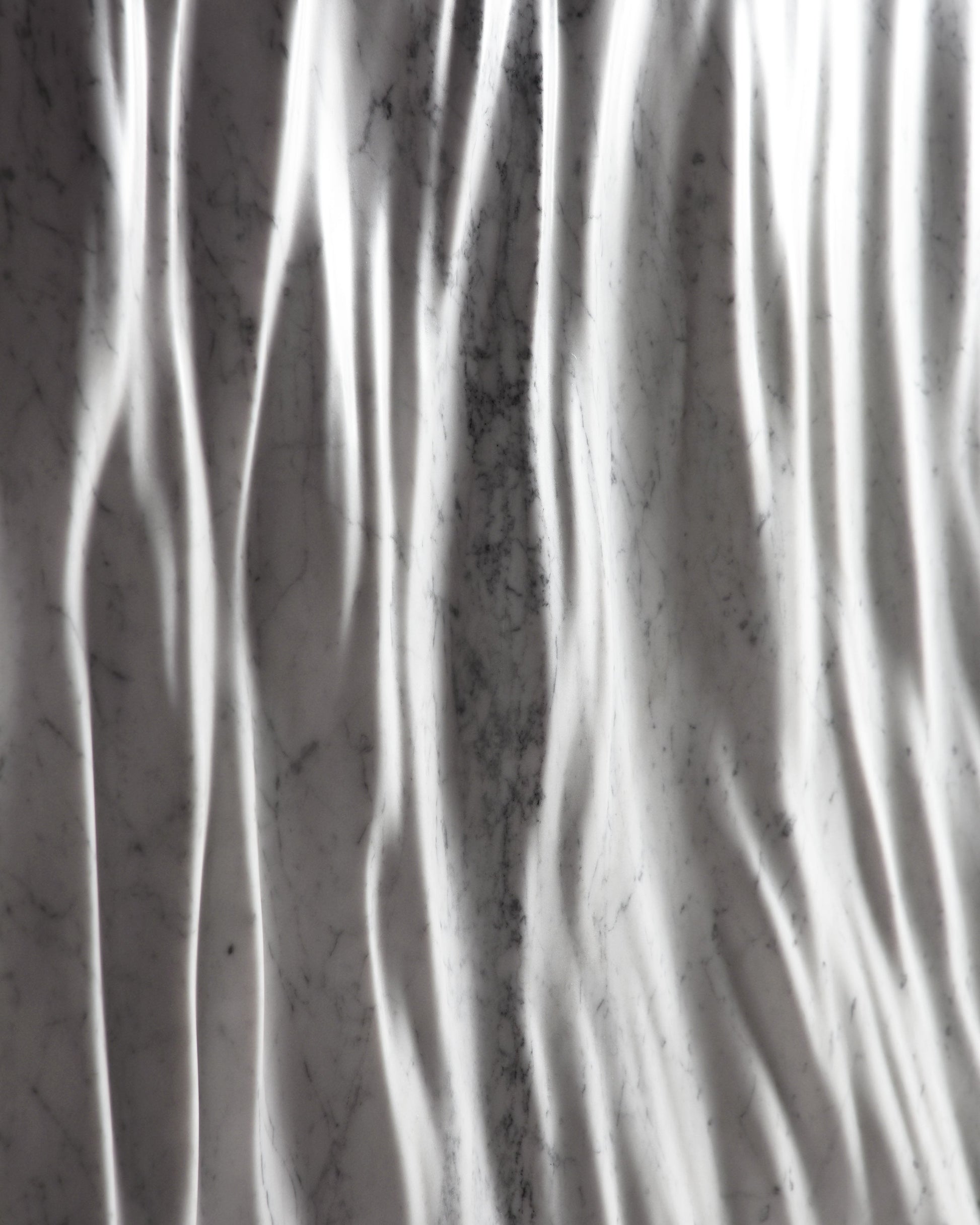 High contrast close up of the Eternal Carrara marble folds with deep shadow lines