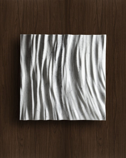 Eternal Carrara marble wall sculpture displayed on a warm walnut background