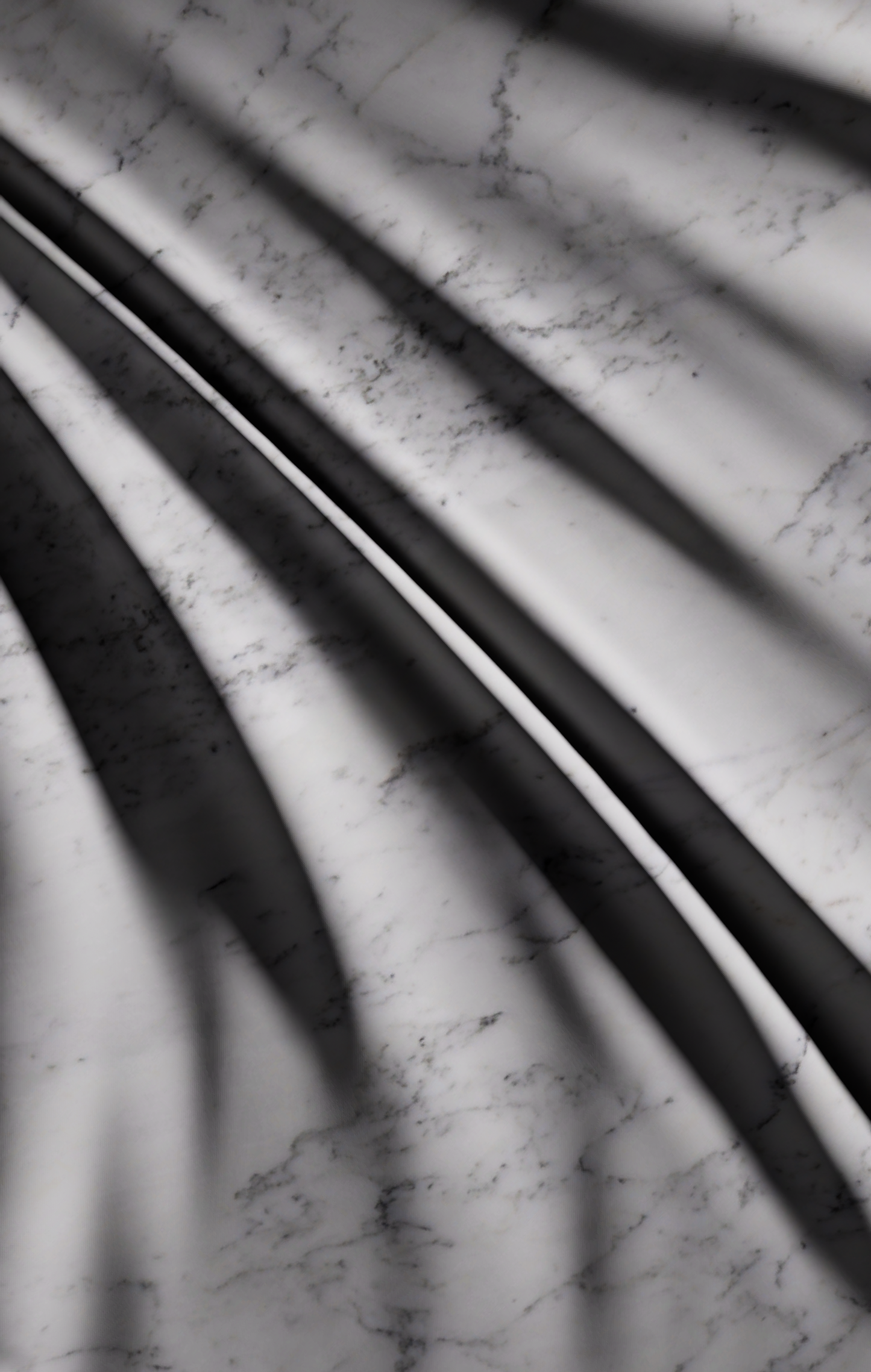 Detail of Carrara marble sculpture showing sharp fold ridges and soft transitions in light and shadow