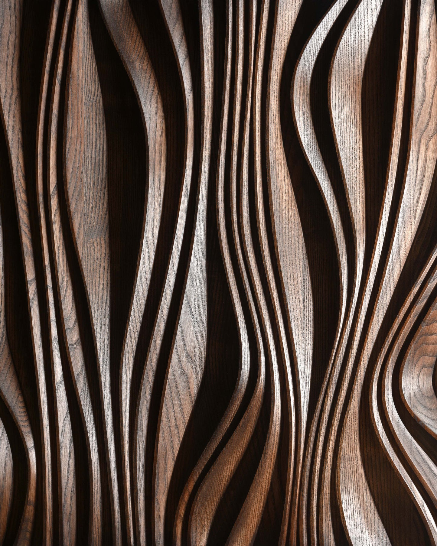 Close up of layered carving in brown finish, relief depth detail