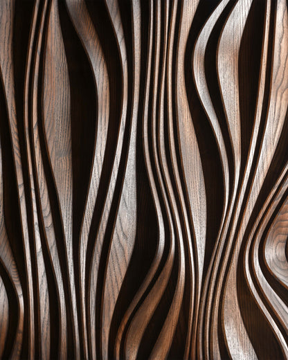 Close up of layered carving in brown finish, relief depth detail
