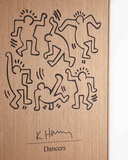 Corner detail focusing on the black accent portion meeting the oak surface, underlining the geometric synergy in Kate Harring’s dancers.