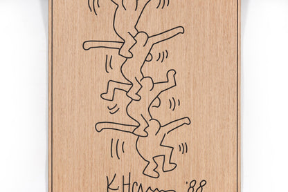 Front view of the acrobat panel with carved black lines on oak