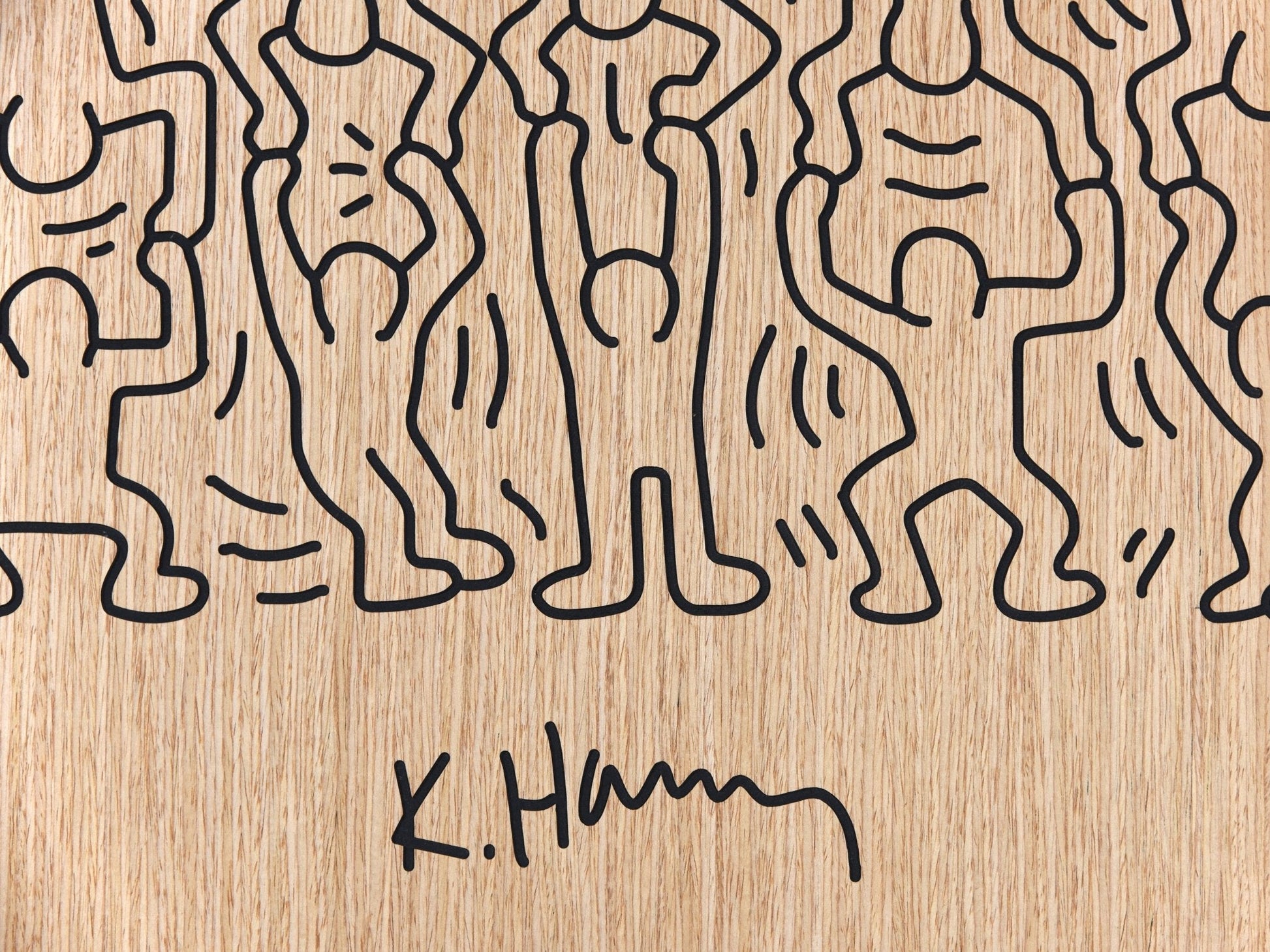 Close up of the crowd panel with signature detail carved on oak