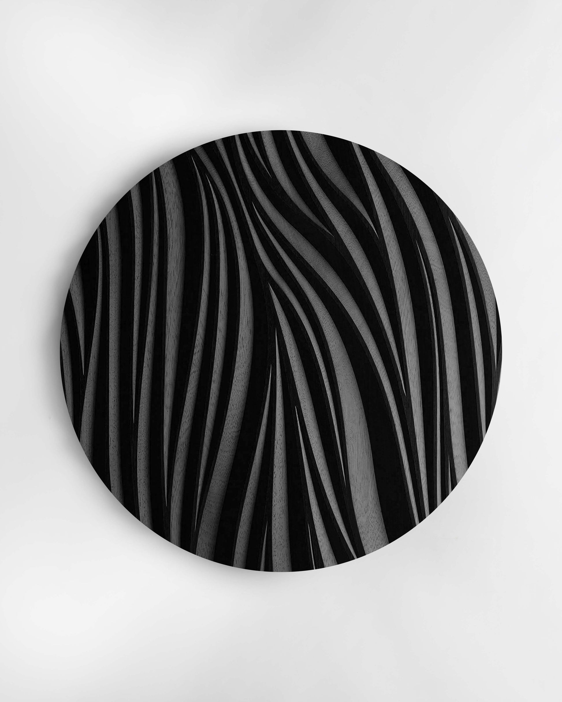 Leaf circular wall sculpture in black finish, front view on white background