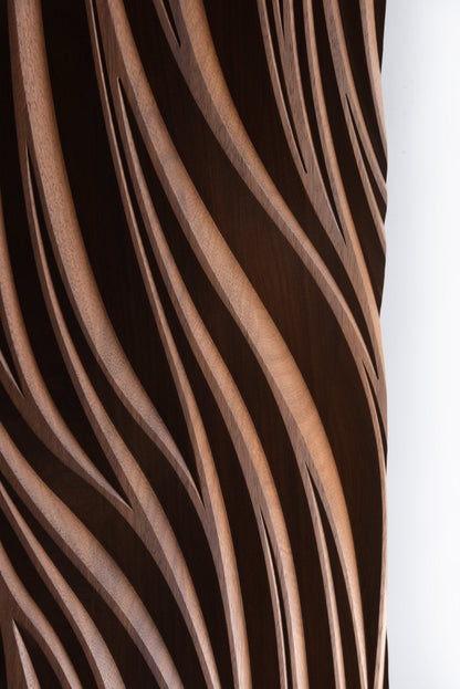 Close up of the Leaf iroko carving showing smooth depth and layered lines