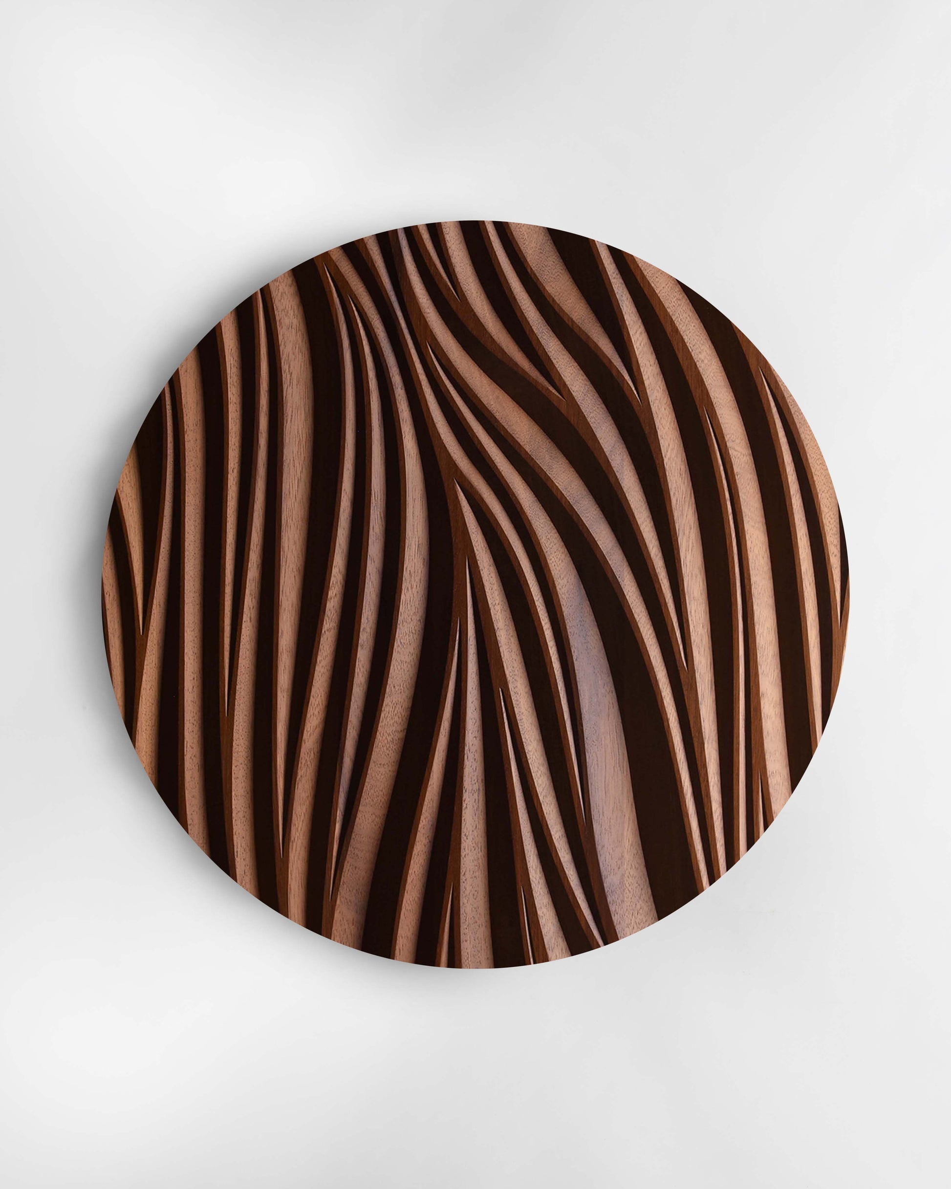 Leaf circular wall sculpture in iroko, front view on white background