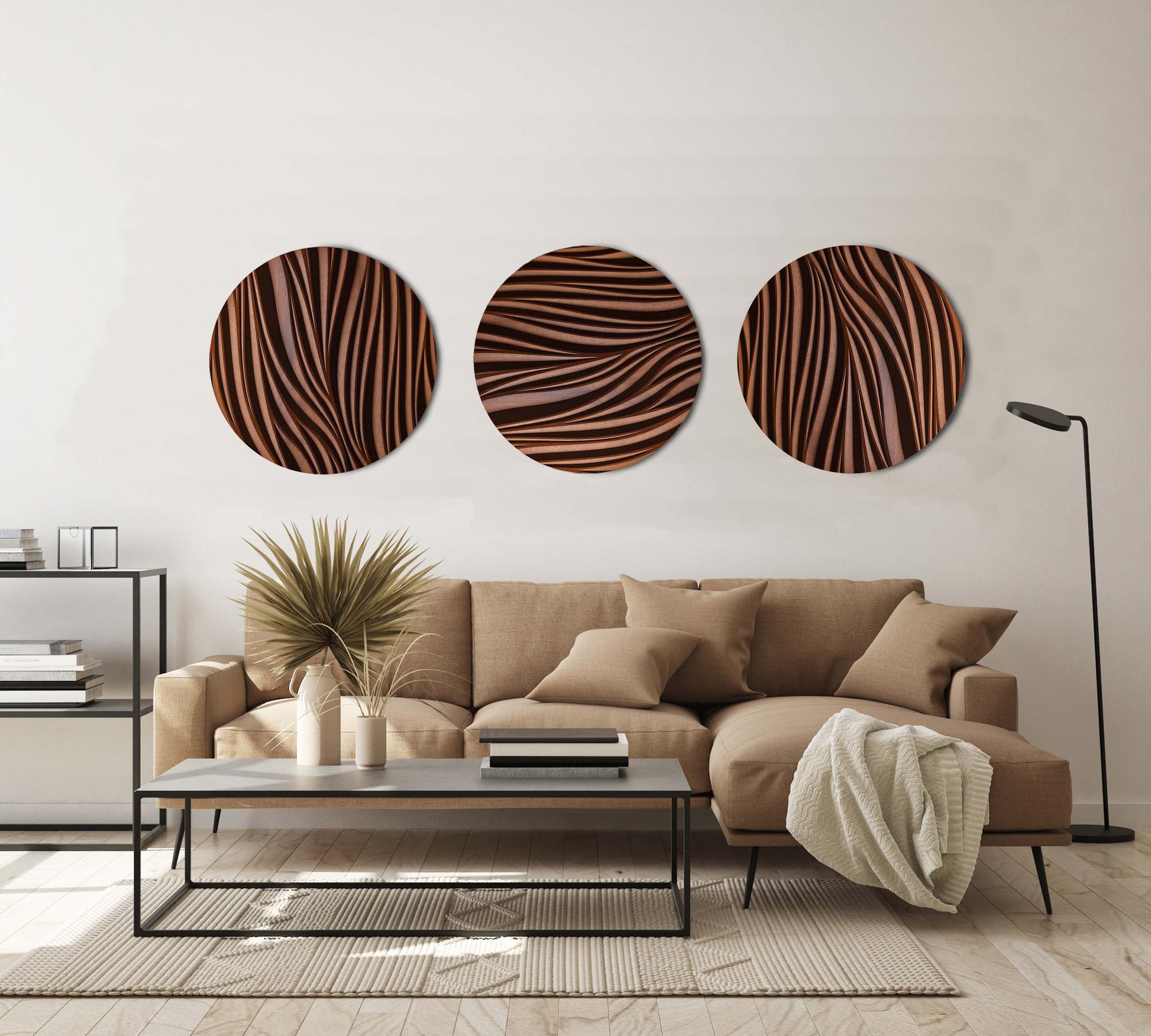 Leaf Wall Set of three round iroko sculptures installed above a sofa in a modern living room