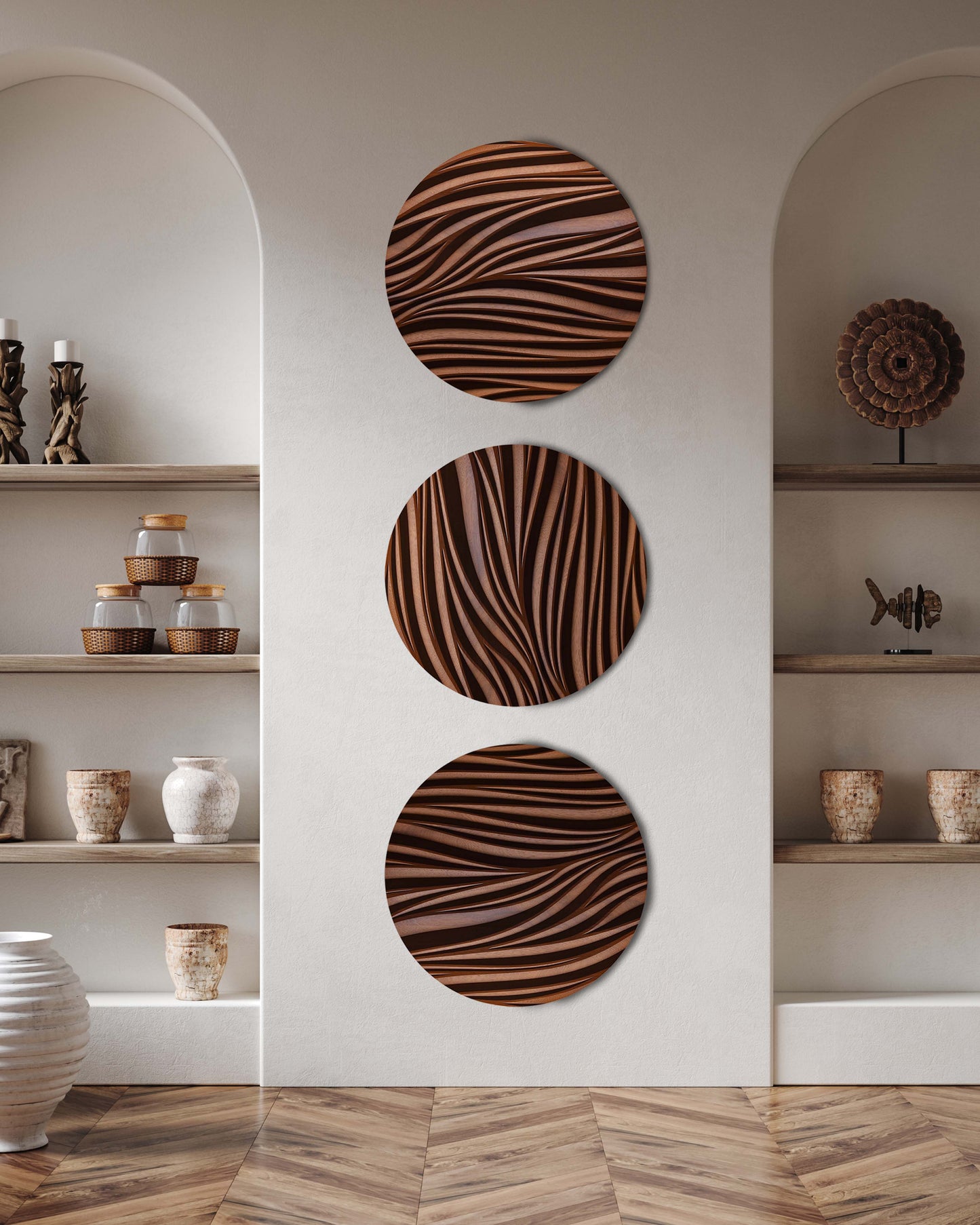 Vertical installation of three Leaf iroko round sculptures creating a balanced wall composition
