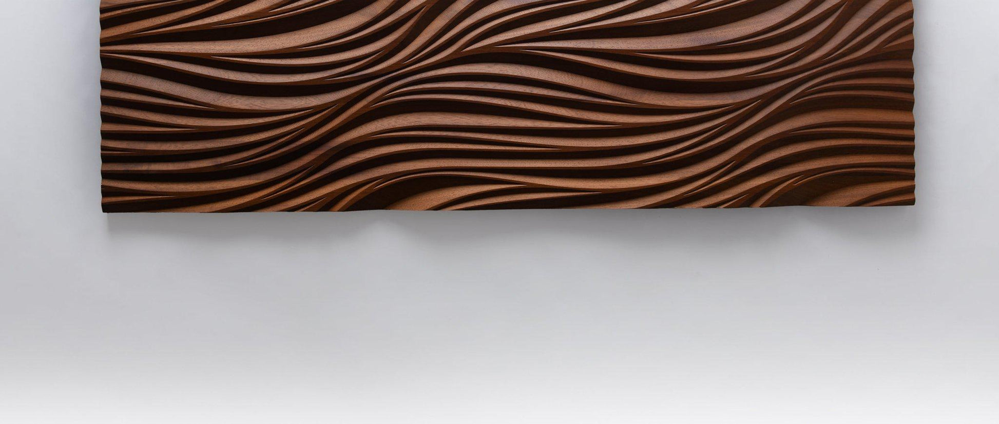 Macro look at leaf-inspired lines, adding geometric design flair to a wood accent wall in any modern house layout.