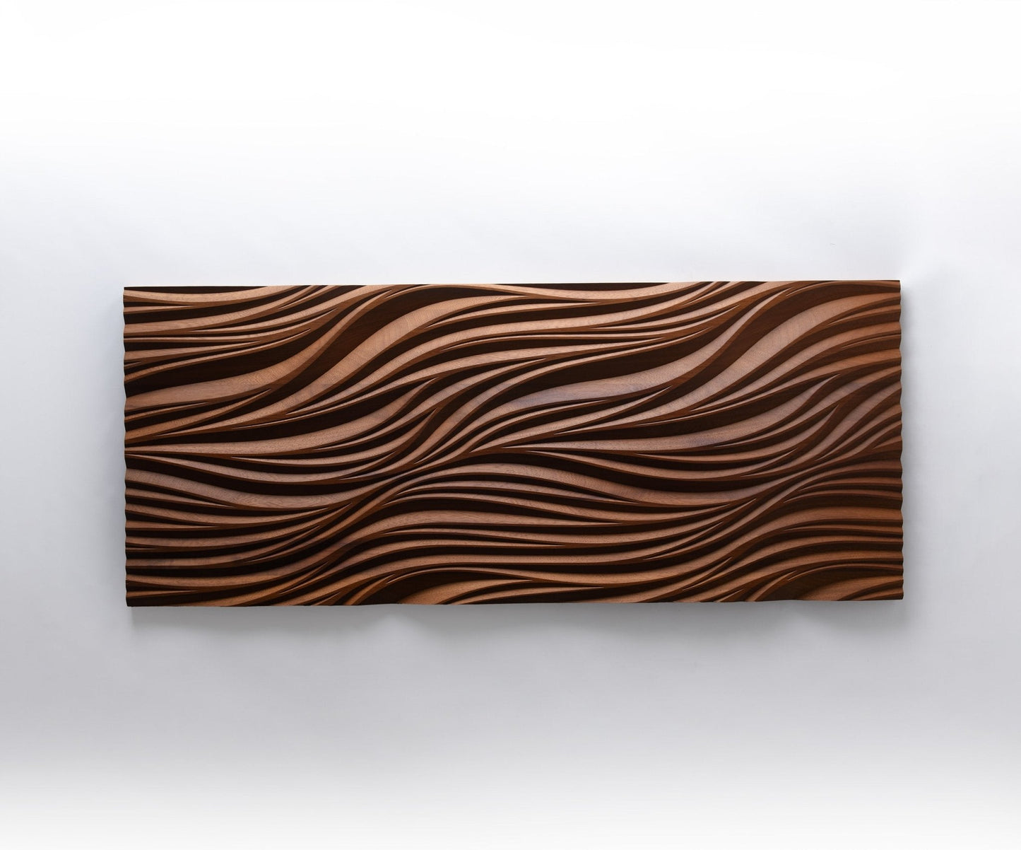 Detailed shot of leaves & nature motif, pairing wooden wall panels appeal with tactile geometric design in richly toned iroko.