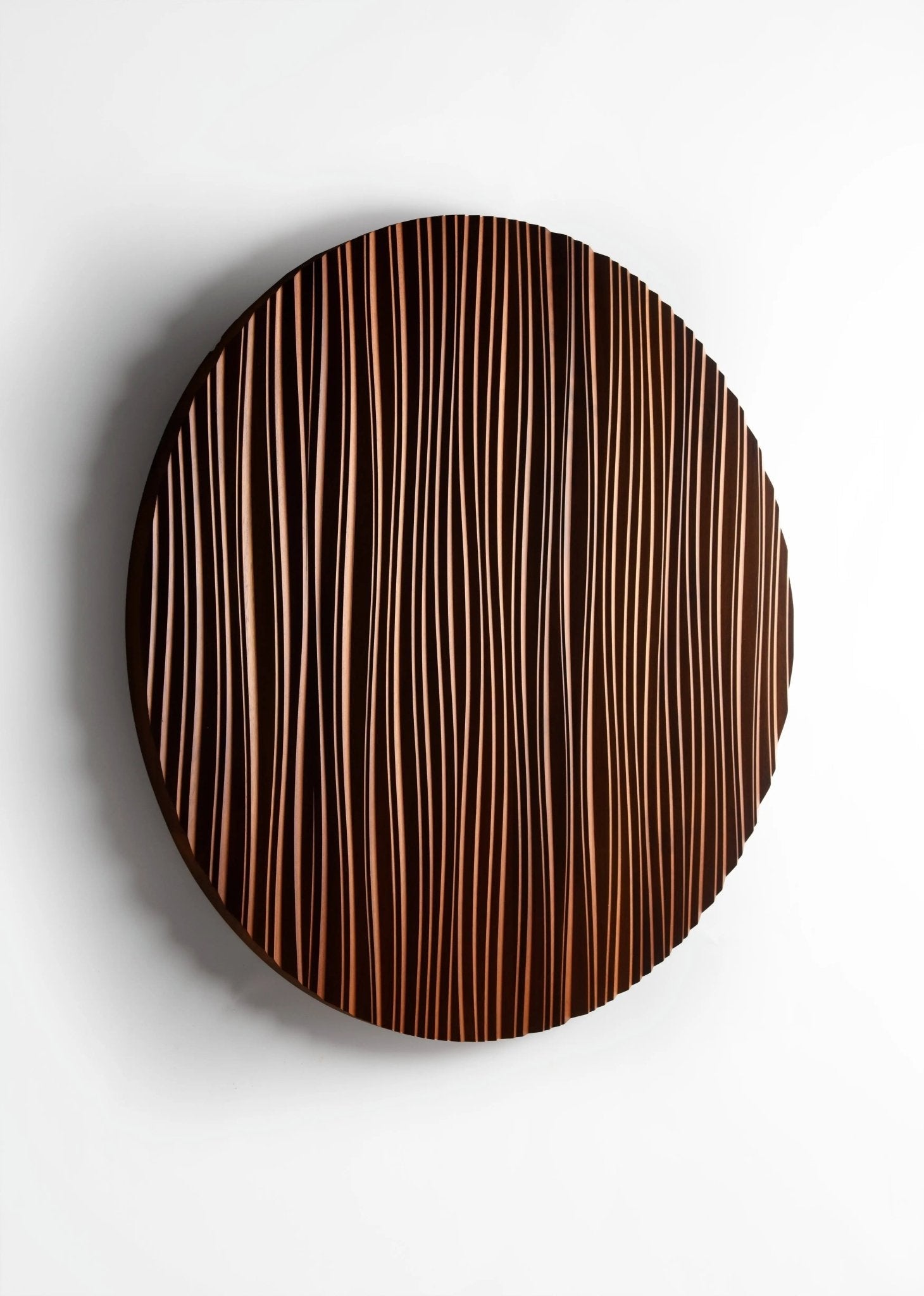 Zoomed-in view of ‘The Line’ waves etched into Iroko, reflecting wooden wall panels craftsmanship and refined interior decoration aesthetics.
