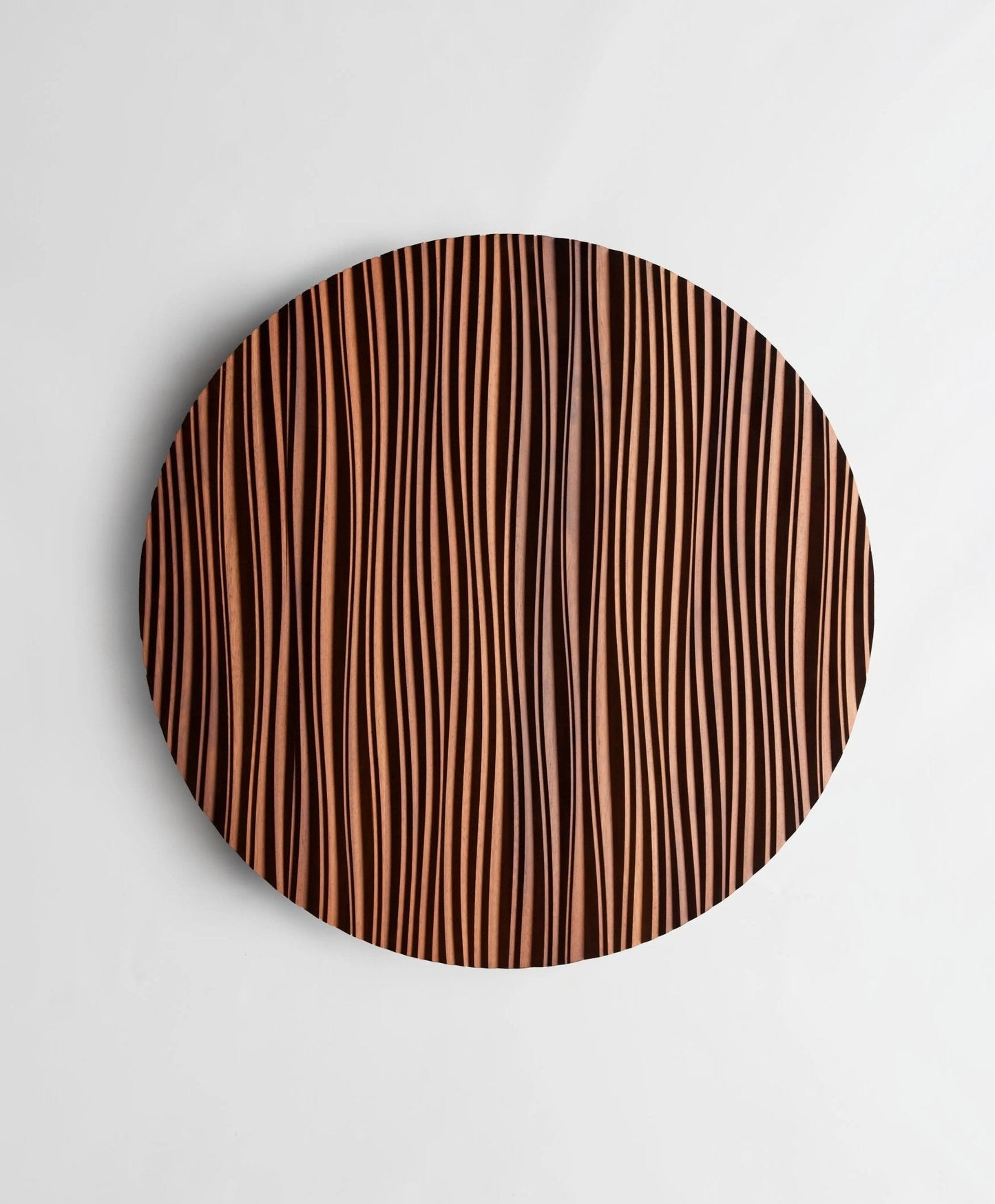 Zoomed-in view of ‘The Line’ waves etched into Iroko, reflecting wooden wall panels craftsmanship and refined interior decoration aesthetics.