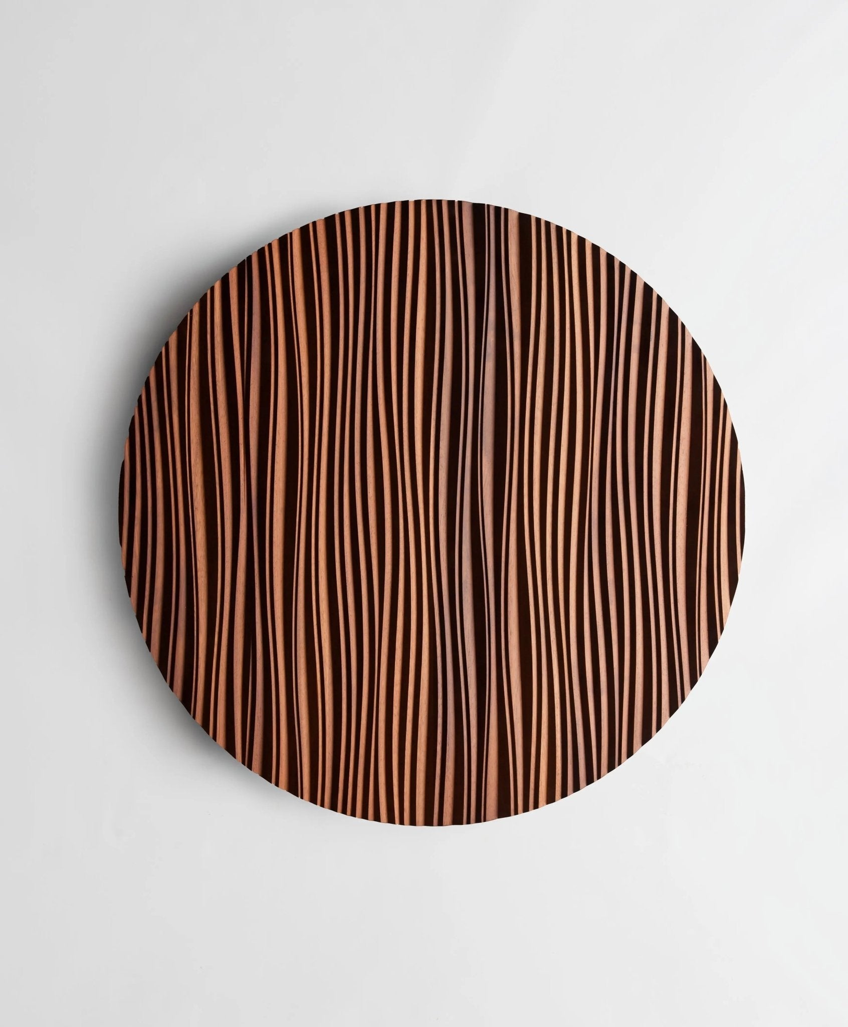Zoomed-in view of ‘The Line’ waves etched into Iroko, reflecting wooden wall panels craftsmanship and refined interior decoration aesthetics.