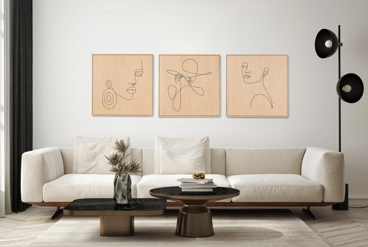 Three piece set of carved line portrait artworks in oak with black detail above a sofa