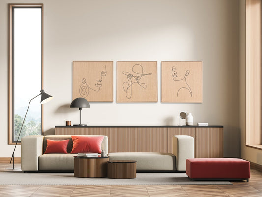 Three piece set of carved line portrait artworks in oak with dark line detail, styled above a sideboard