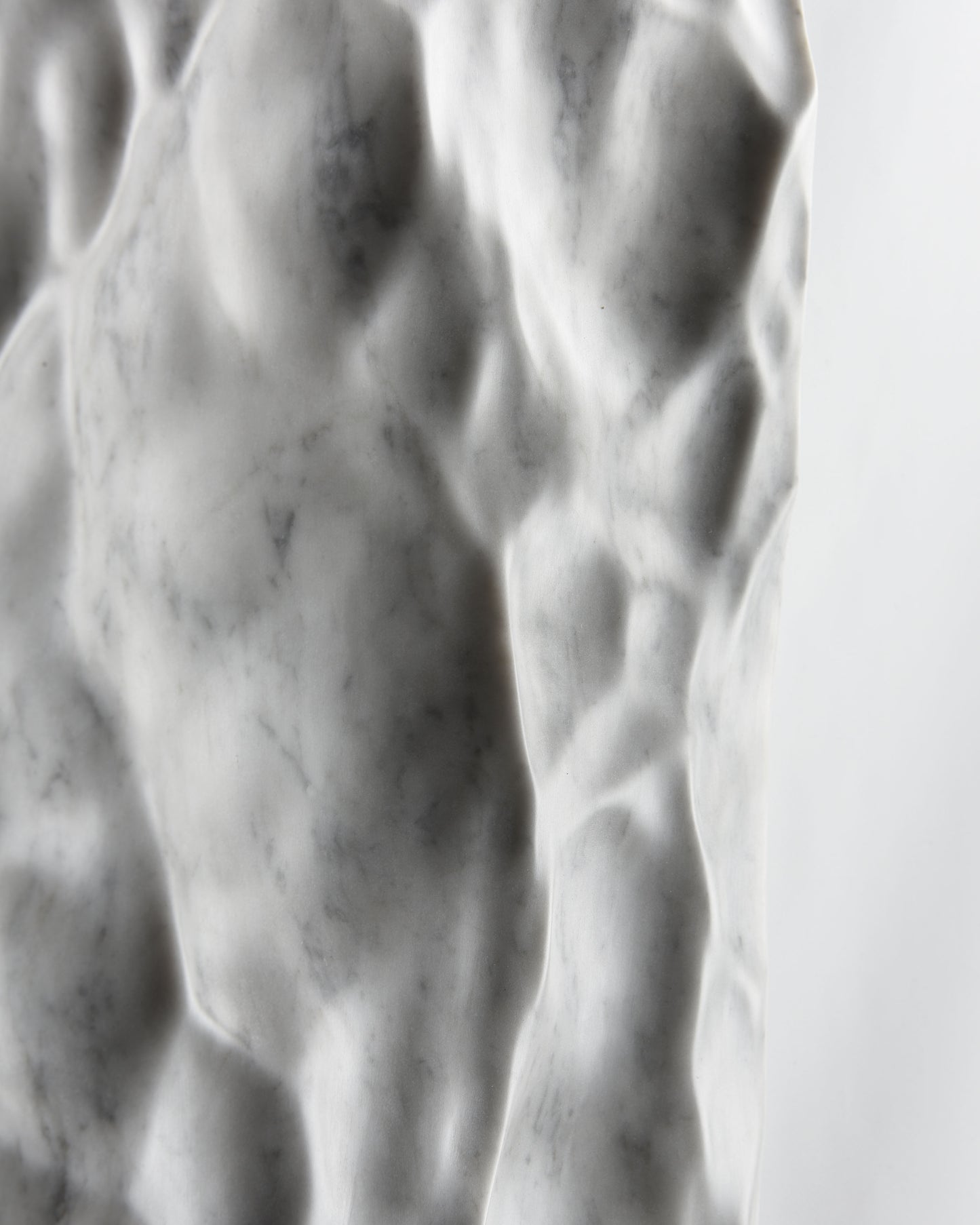Close up of shadow and natural grey veining across the Liquid Marble Carrara surface