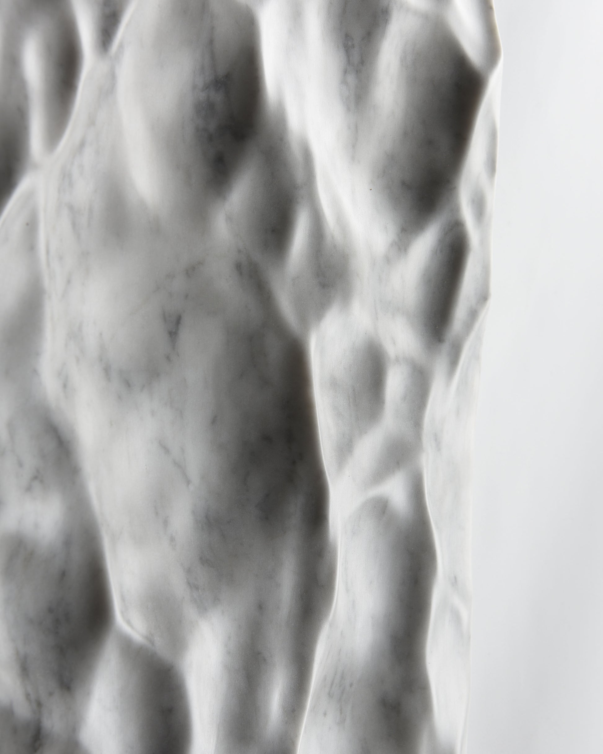 Close up of shadow and natural grey veining across the Liquid Marble Carrara surface