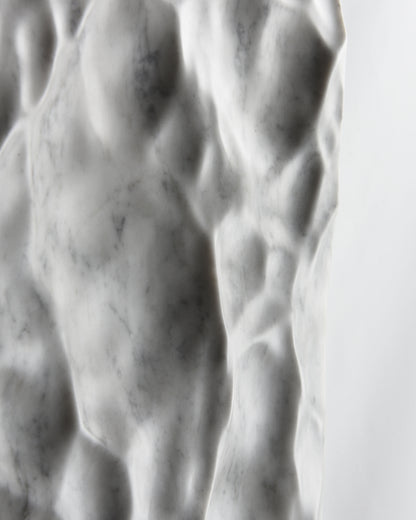 Close up of shadow and natural grey veining across the Liquid Marble Carrara surface