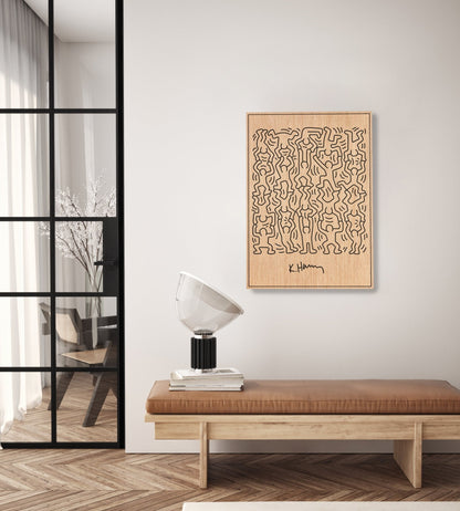 Little Men Keith Haring oak wall art styled above a bench in a modern interior