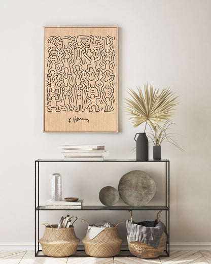 Little Men Keith Haring carved oak wall art with black lines, styled above a console table
