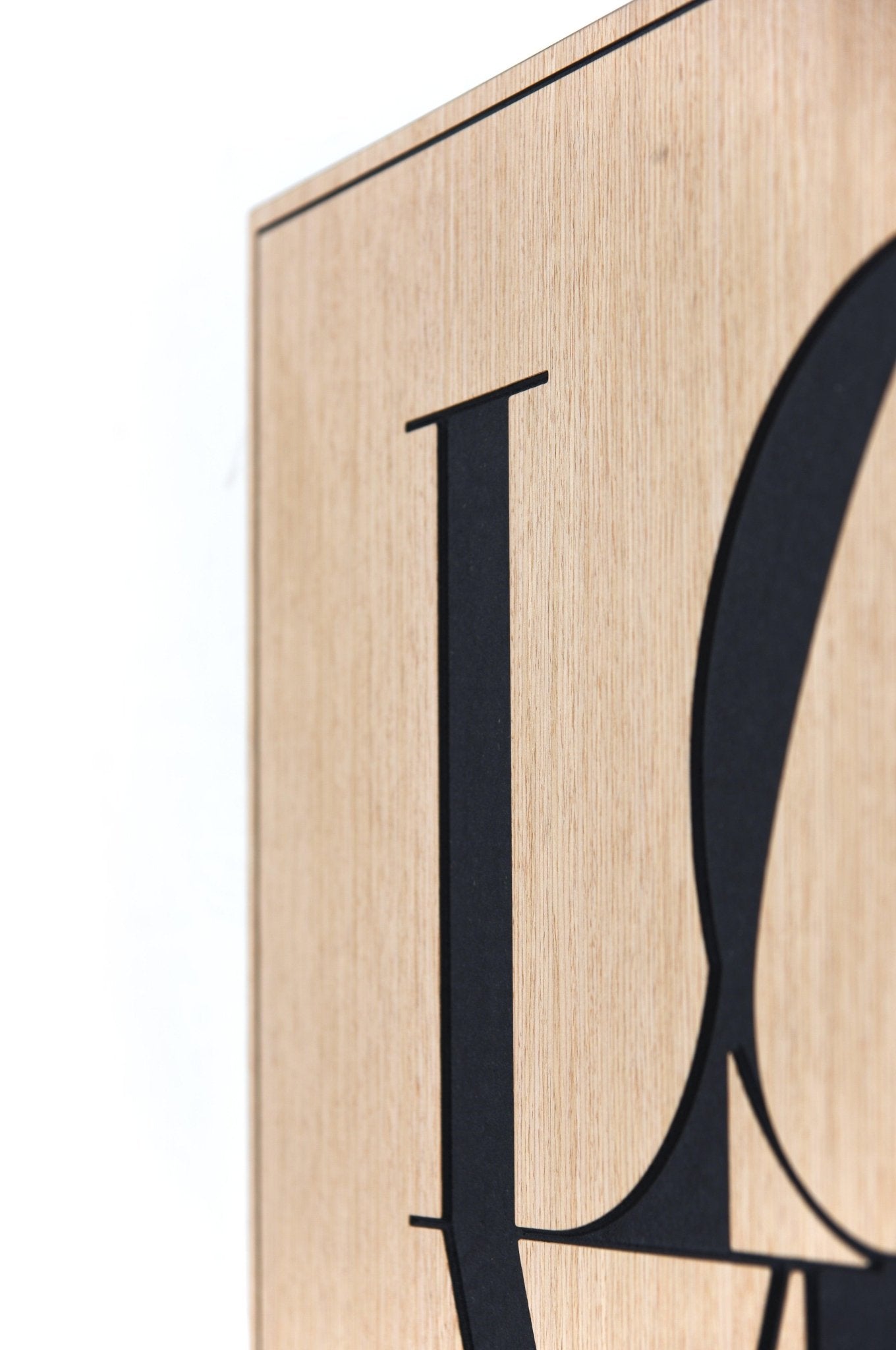 Close up detail of the carved lettering on the Love oak wall artwork