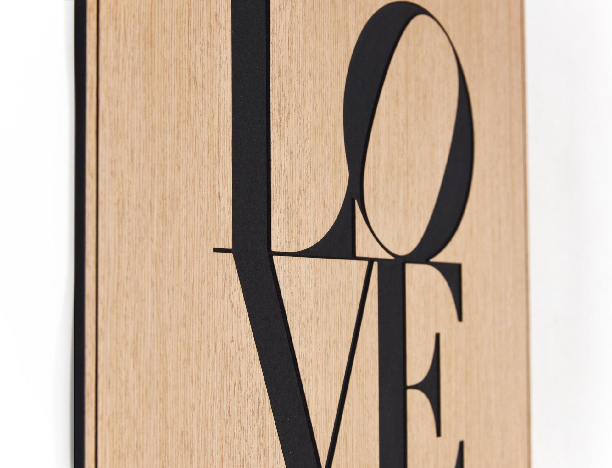Side profile view of the Love artwork highlighting thickness and the black insert detail