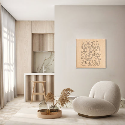 Merging of Faces carved oak wall art displayed in a bright modern living space