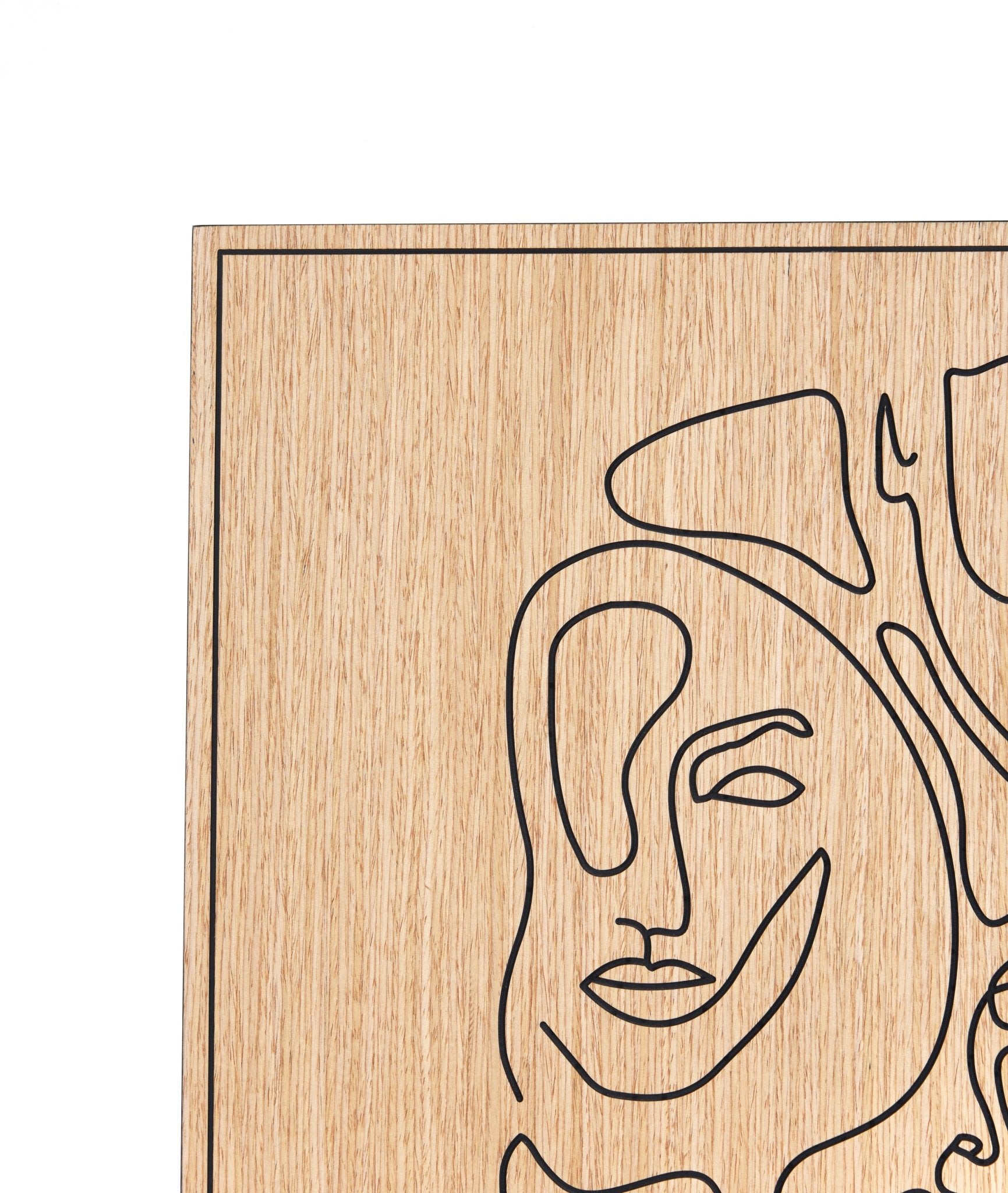 Corner crop showing oak grain and carved line finish on Merging of Faces