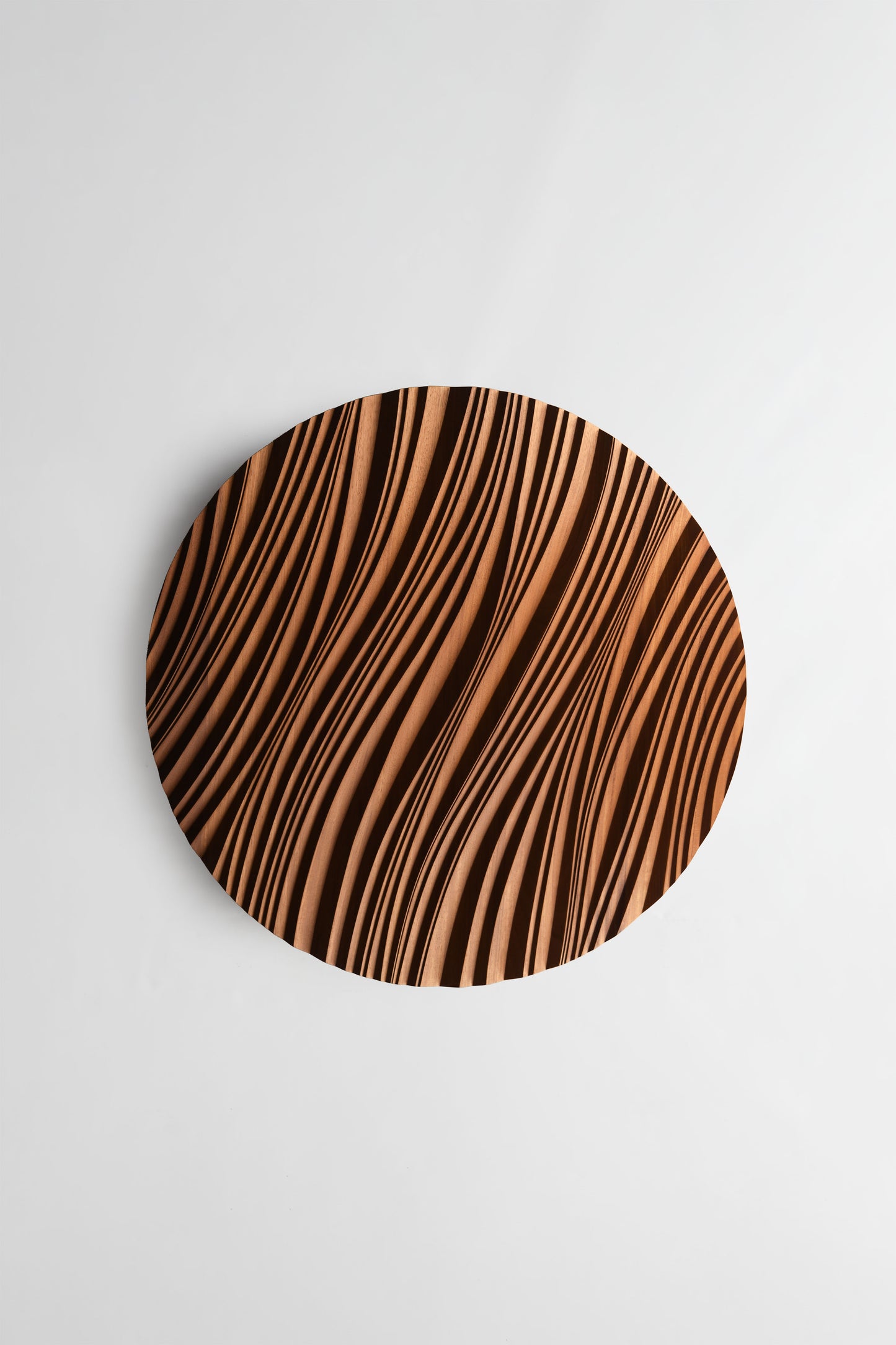 Close focus on swirling erosion ridges in iroko, echoing 3d wall panels style with subtle geometric design in each carved wave.