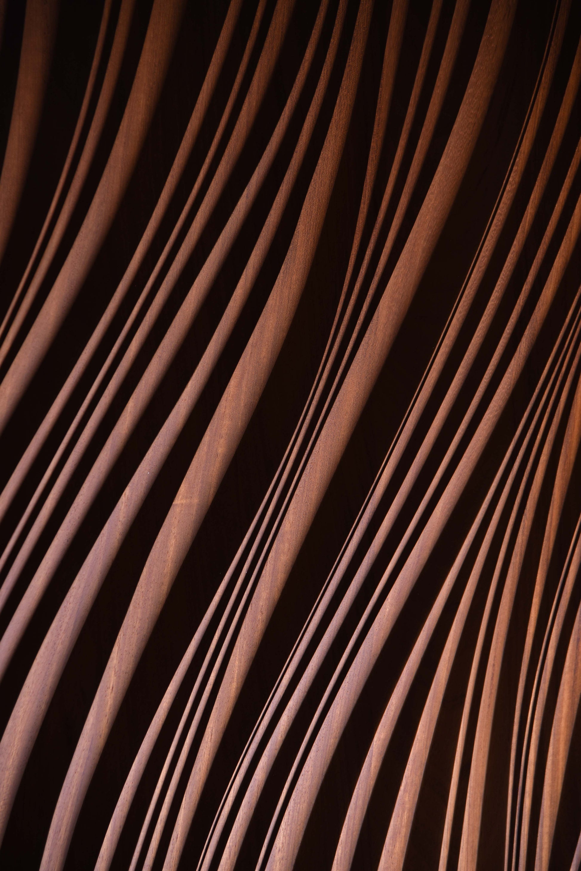 Macro shot of layered erosion texture in iroko, complementing scandi interior aesthetics or boho chic interior warmth in subtle waves