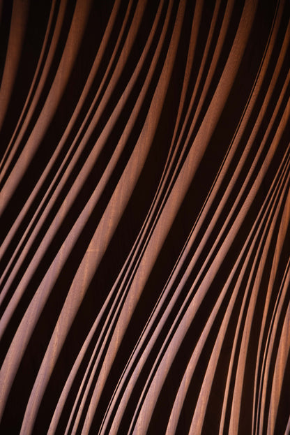 Macro shot of layered erosion texture in iroko, complementing scandi interior aesthetics or boho chic interior warmth in subtle waves