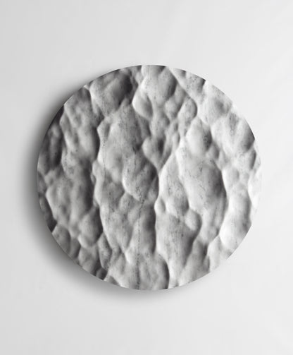 Round Liquid Marble Carrara wall sculpture front view with fluid carved relief and natural grey veining
