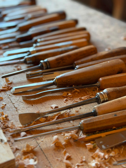 Traditional woodworking chisels used to hand finish the sculptural surface of Strata