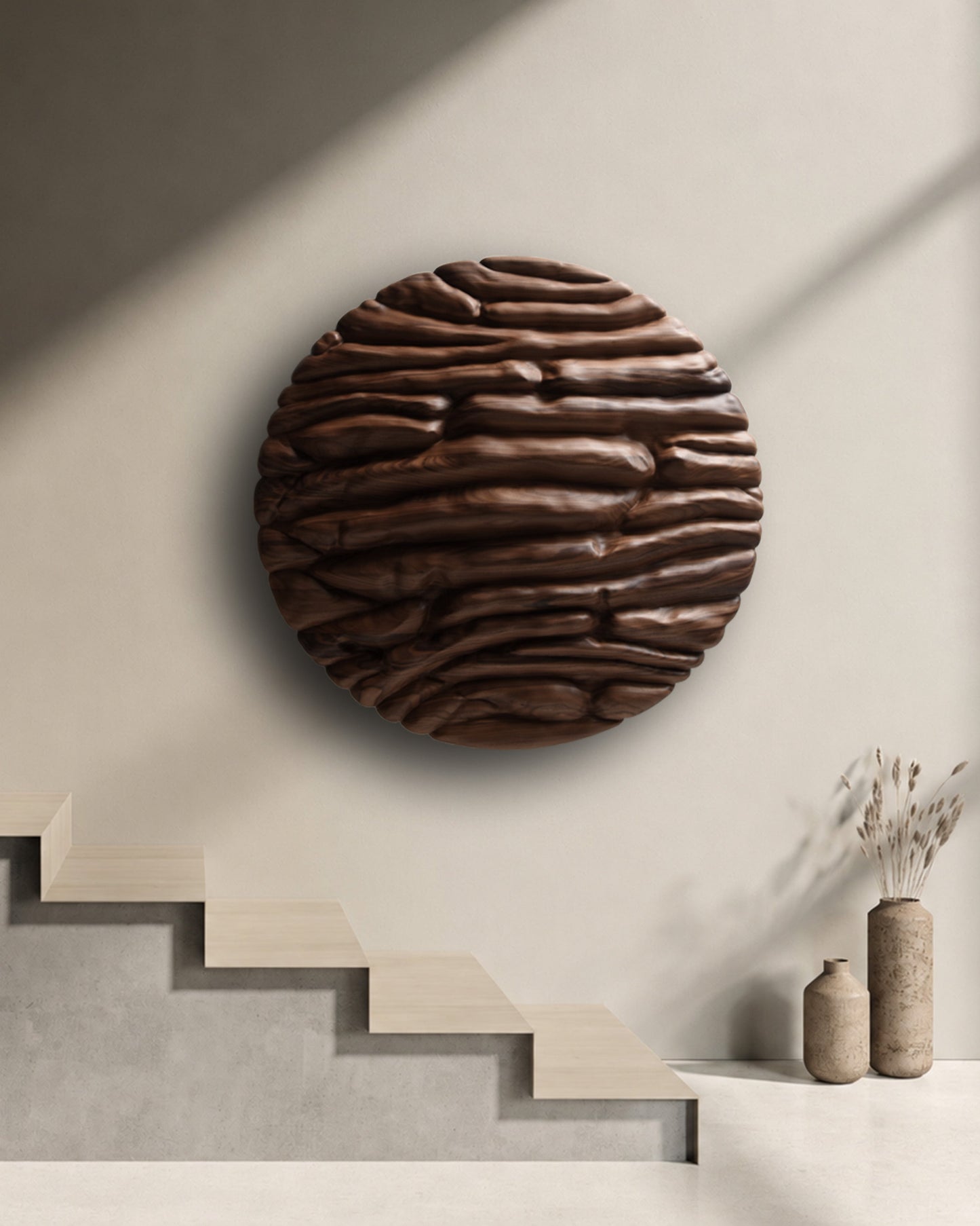 Round walnut wall sculpture installed in a minimal interior beside a sculptural staircase